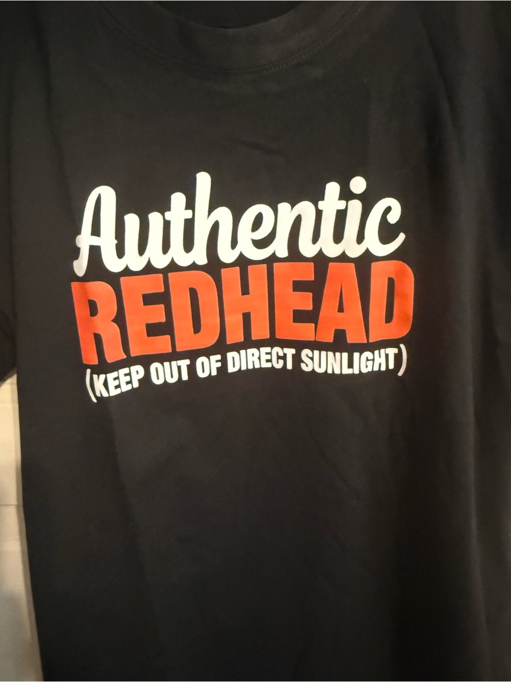 Source Unknown Black Tee with White and Red "Authentic REDHEAD" Graphic